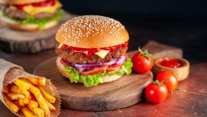 front-view-yummy-meat-cheeseburger-with-french-fries-dark-background-dinner-burg